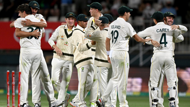 The Australians enjoy the moment after winning the fifth Test at Blundstone Arena.