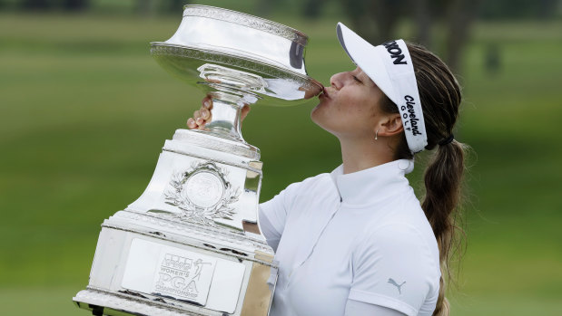 Hannah Green celebrates with her trophy after winning the Women's PGA Championship.