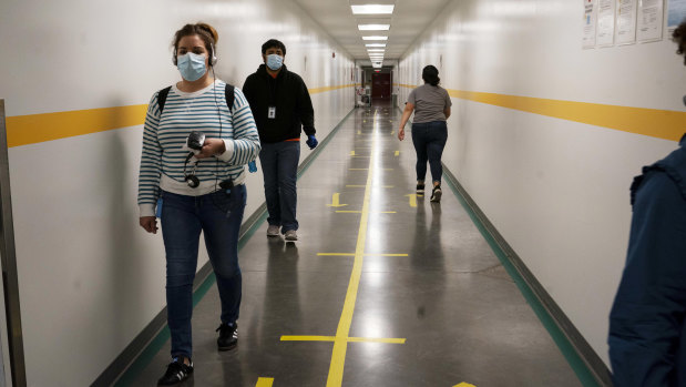 Lanes in a corridor help employees maintain social distance 