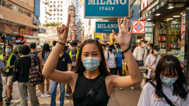 A woman makes a gesture during a protest against the national security law in Hong Kong on June 28. 
