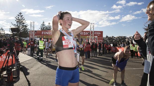 Ellie Pashley catches  her breath after fbeing the first female competitor to finish the 2018 City to Surf on 12 August 2018. 

