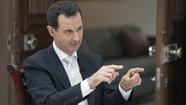 Syrian President Bashar al-Assad speaks during an interview with the Greek Kathimerini newspaper, in Damascus, Syria. 