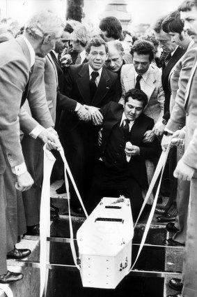 Sam Gulle at the graveside of his family