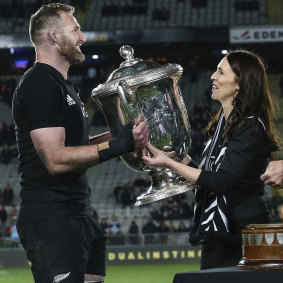 Safe for another year: Kieran Read receives the Bledisloe Cup from New Zealand Prime Minister Jacinda Ardern.