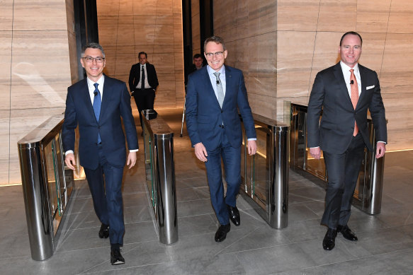 From left, BHP chief executive Mike Henry, former CEO Andrew Mackenzie and chairman Ken MacKenzie at the company's Melbourne headquarters.