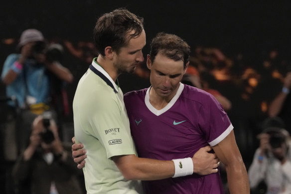 Rafael Nadal and Daniil Medvedev embrace at the end of their five-set thriller.