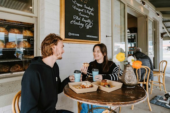 The bakery has seating on the balcony. 