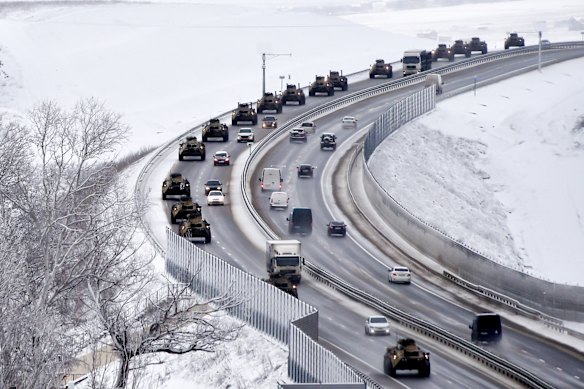 Russian armored vehicles move along a highway in Crimea last week.