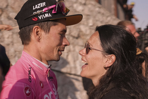 Roglic is congratulated by his wife Lora.