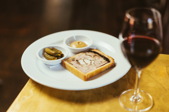 Pâté en croute with mustard and cornichons.