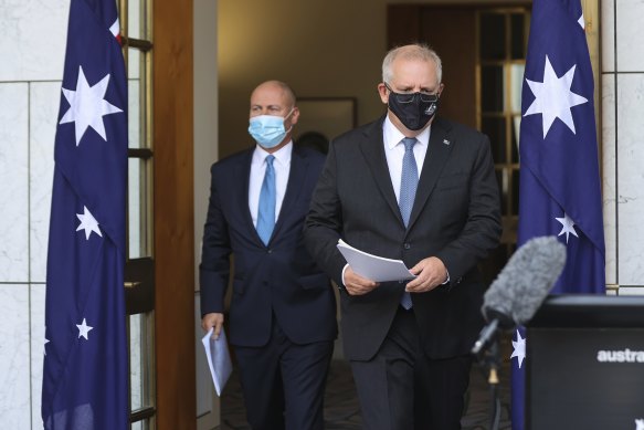 Prime Minister Scott Morrison and Treasurer Josh Frydenberg arriving for today’s press conference. 