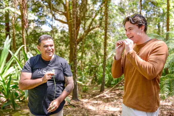 Uncle Bernie invites us to taste the crushed leaves of a sarsaparilla vine.