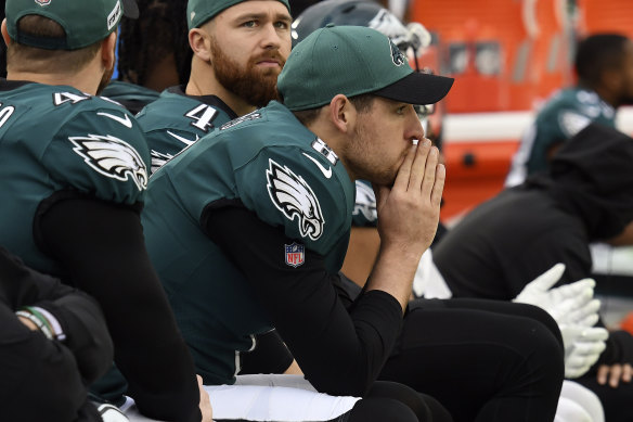 Punter Arryn Siposs on the bench for the Eagles.