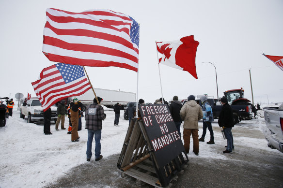 Protesters block access to the Canada-United States border crossing at Emerson, Manitoba, with heavy trucks and farm equipment on Thursday.