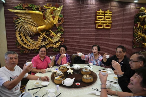 People have lunch in a restaurant in Hong Kong last week after the city reopened beaches and pools in relaxation of COVID-19 restrictions.