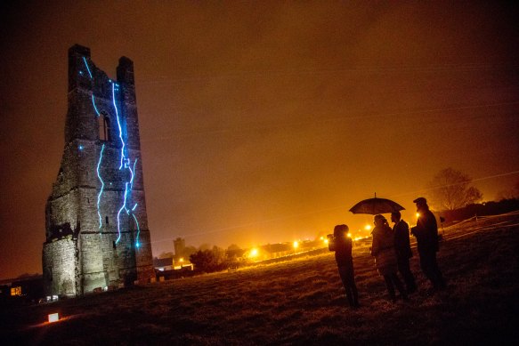 An ancient Trim castle lights up for festival-goers.