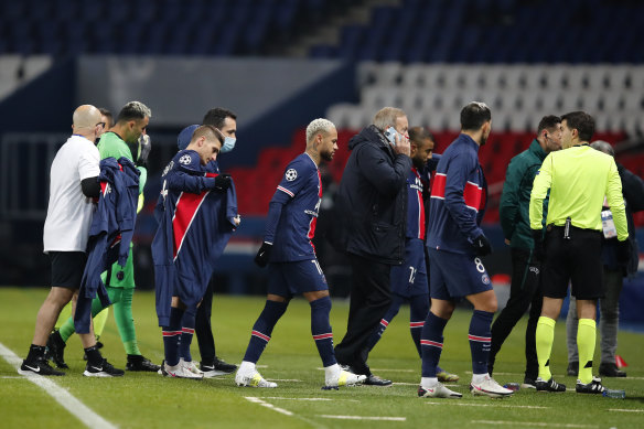 Players leave the pitch in the Champions League match between PSG and Basaksehir after anger at an alleged racial slur from a fourth official.