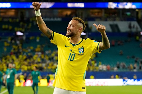 Brazil’s Neymar celebrates after the World Cup Group C soccer match between Scotland and Brazil.