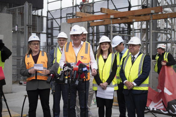 Then-premier Daniel Andrews announces Labor’s new housing statement in September atop a building being developed in Macaulay.