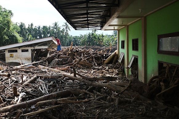 Logs and debris at a boarding school in Pidie Jaya.