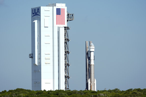 Boeing’s Starliner capsule, pictured atop an Atlas V rocket, will remain on earth for now.