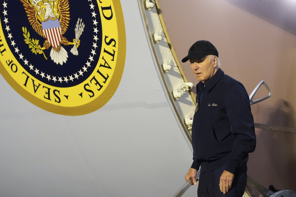 President Joe Biden walks down the steps of Air Force One at Dover Air Force Base in Delaware,.