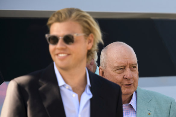 Jake Thrupp (left) with Alan Jones and guests at the broadcaster’s farewell boat party after his final 2GB show in 2020.