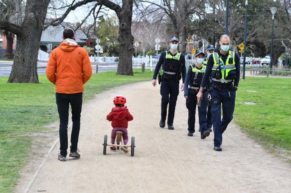 Police patrol Princes Park in Carlton on Tuesday morning.