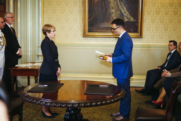 Daniel Mookhey being sworn in as treasurer on the Bhagavad Gita, a Hindu holy book.