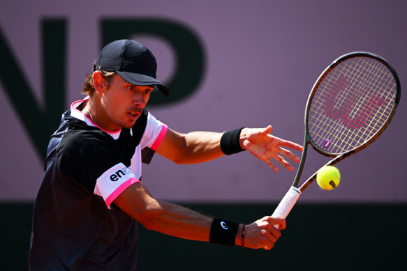 Alex de Minaur returns the ball to Ilya Ivashka during their men’s first-round clash.