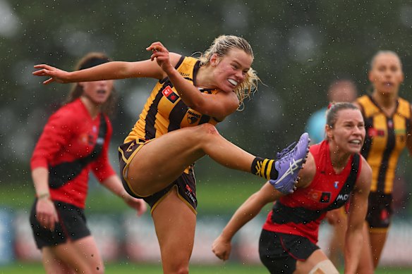 Hayley McLaughlin of the Hawks kicks for goal against Essendon on Sunday.