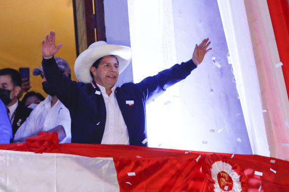 Newly Elected President of Peru Pedro Castillo waves at supporters.
