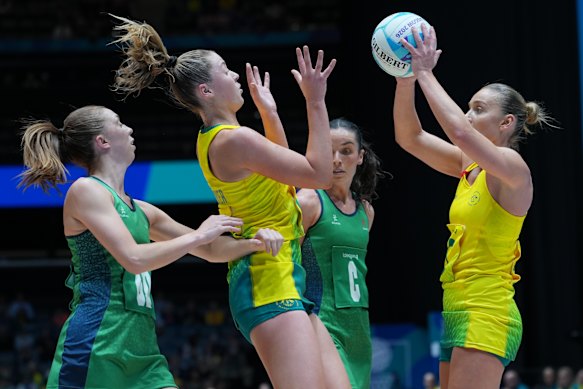 Australia’s Liz Watson, right, attempts a pass to teammate Sophie Dwyer.