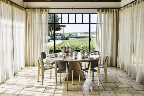 The breakfast room in Kourtney Kardashian’s home looks out onto the swimming pool. 