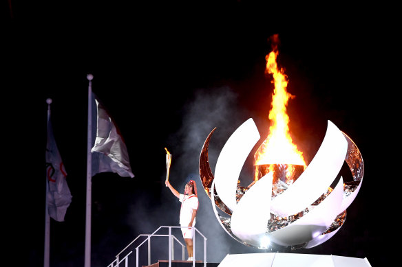 Naomi Osaka lights the Tokyo Olympic Games cauldron.