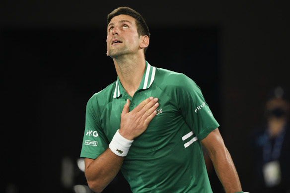 Novak Djokovic celebrates after advancing through to the semi-finals at the Australian Open.