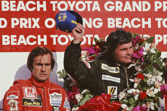 Alan Jones (right)  after winning the United States Grand Prix West on March 15, 1981. 
