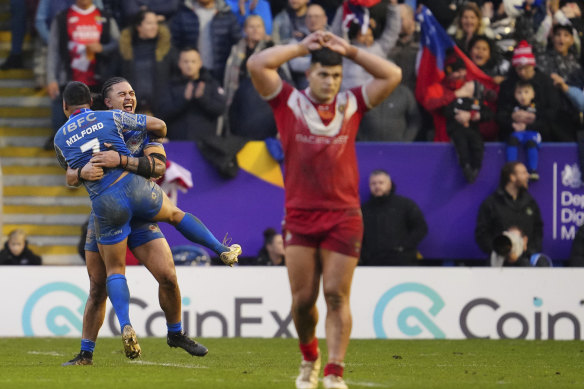 Samoan players celebrate after their historic win.