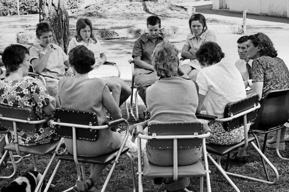 Jessamine (centre back, hand on ear) at a Kamballa therapy session in 1975.