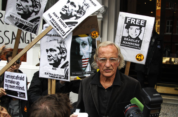 John Pilger talks to members of the media after meeting Julian Assange at the Ecuadorian embassy in London in 2012.