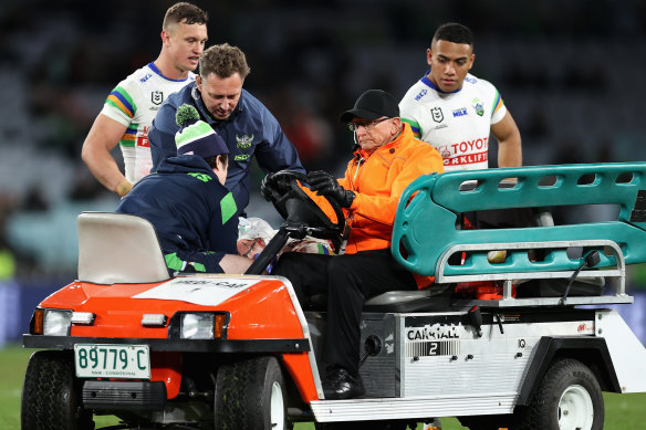 Corey Harawira-Naera in the hands of medical staff after suffering a seizure at Accor Stadium.