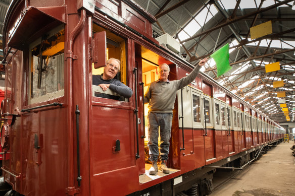 All aboard: Tom Clark, left, and twin brother Kevin in the Red Rattler train at Newport railway workshops.