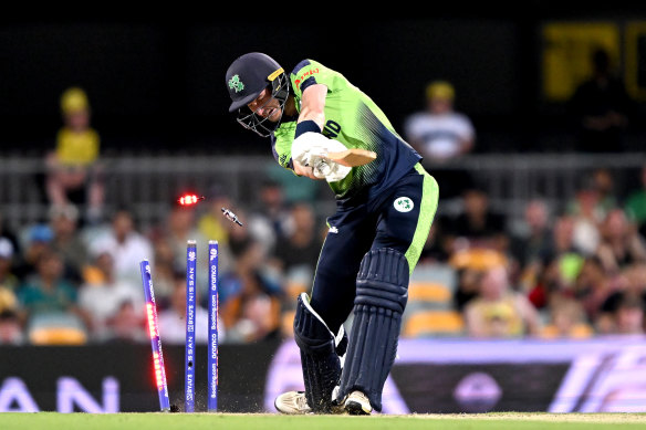 George Dockrell of Ireland is clean bowled by Mitchell Starc. 