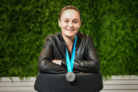 Ashleigh Barty poses with her third straight Newcombe Medal.
