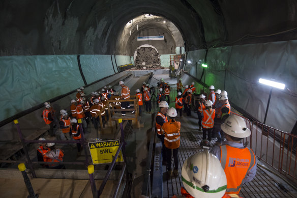 Construction workers near the tunnel boring machine named Nancy, which broke through at the new Pitt Street station on Friday.