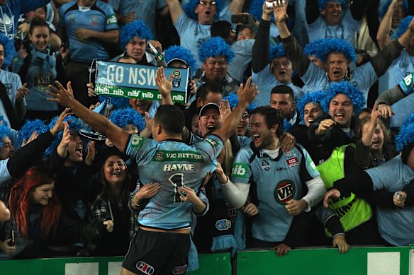 Jarryd Hayne celebrates with NSW fans after the final whistle in game two, 2014 brought to an end Queensland’s run of eight series wins.
