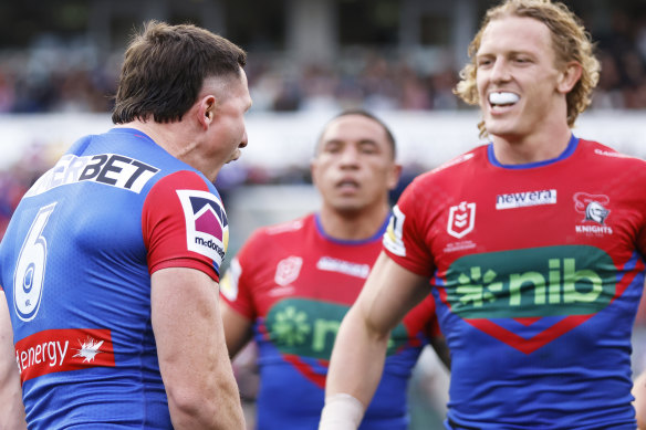 Phoenix Crossland (right) and Tyson Gamble celebrate a Knights try.