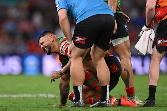 Latrell Mitchell receives medical attention on Friday night.