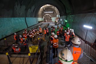 Construction workers near the tunnel boring machine named Nancy, which broke through at the new Pitt Street station on Friday.