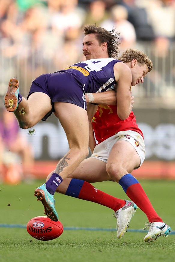 Corey Wagner collects Joe Daniher.
